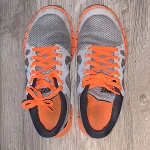 Neon-orange Nike Free 5.0 (slight wear/tear)